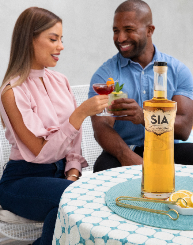 A SIA Blended Scotch Whisky bottle on a serving table at a party