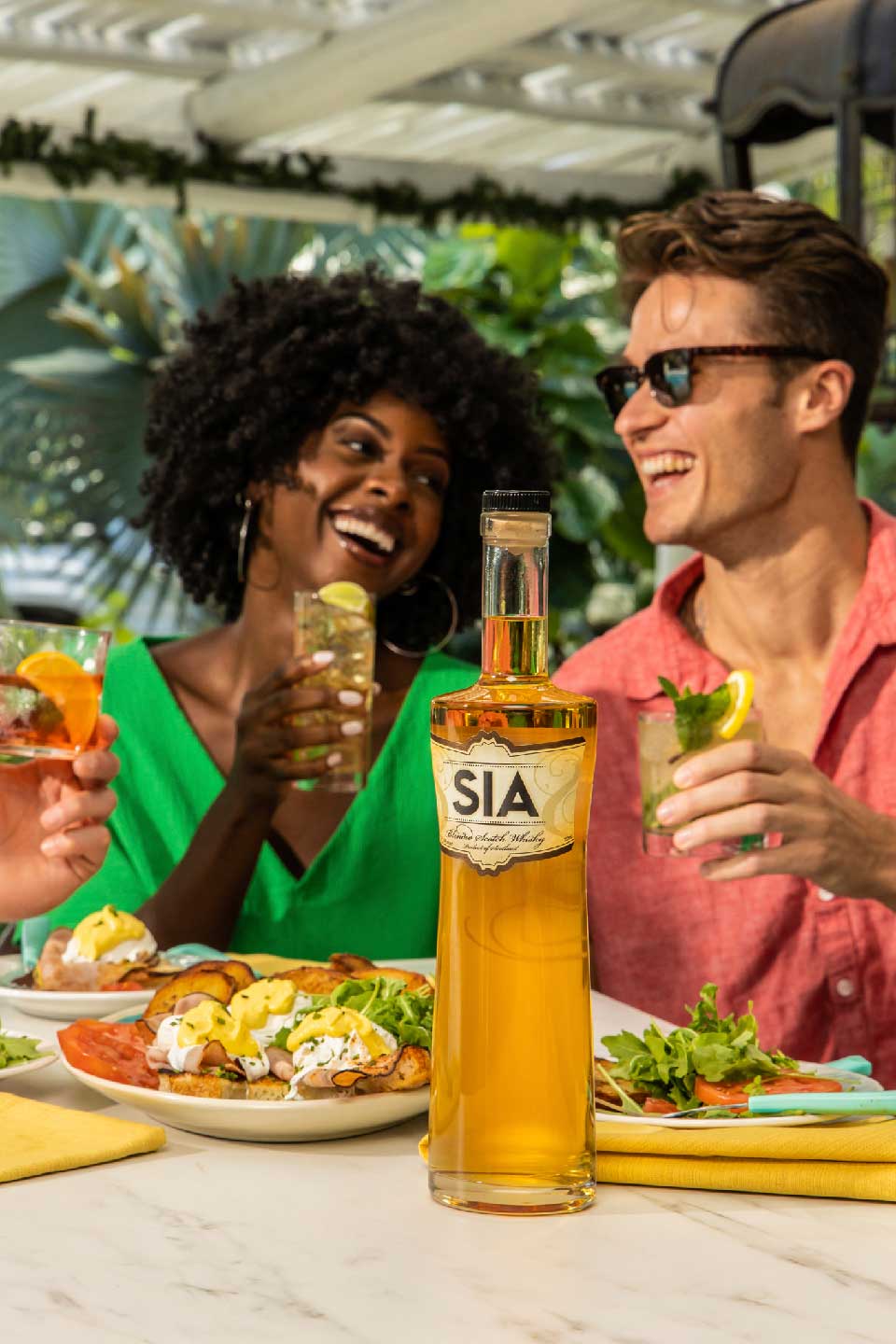 A SIA Blended Scotch Whisky bottle on a serving table at a party